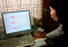A technician analyzes seismic data